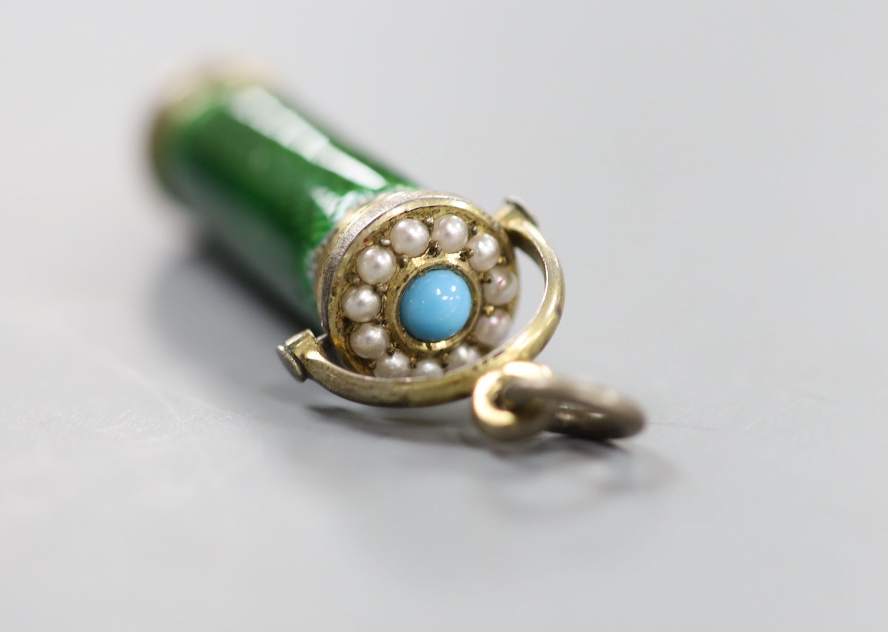 A white metal, enamel and faux seed pearl set propelling pencil (37mm closed), with a Tiffany & Co gilt tooled leather box.